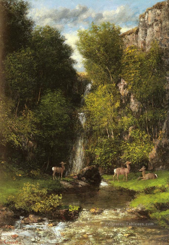 Une famille de cerfs dans un paysage avec une cascade réaliste peintre Gustave Courbet Peintures à l'huile